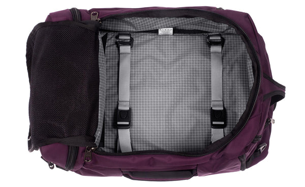 An open Techonaut 45 with an Aubergine (red-ish purple) exterior and a Northwest Sky (grey with white grid) interior.